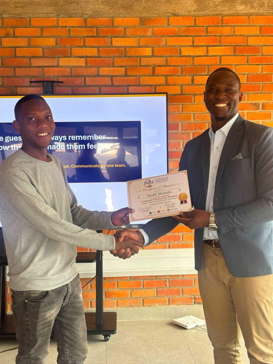 Hospitality professional receiving an NIH training certificate
